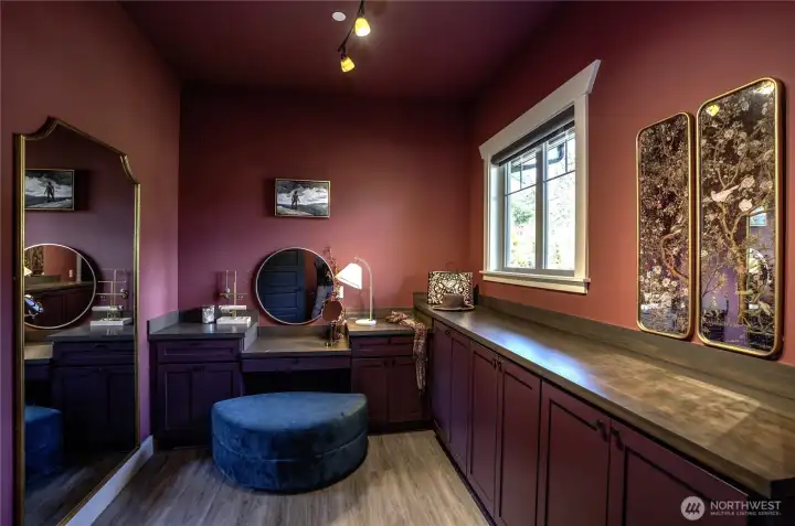 Elevate your daily regimen within this boutique-inspired dressing room. Complete with a dedicated makeup station and extensive tailored storage