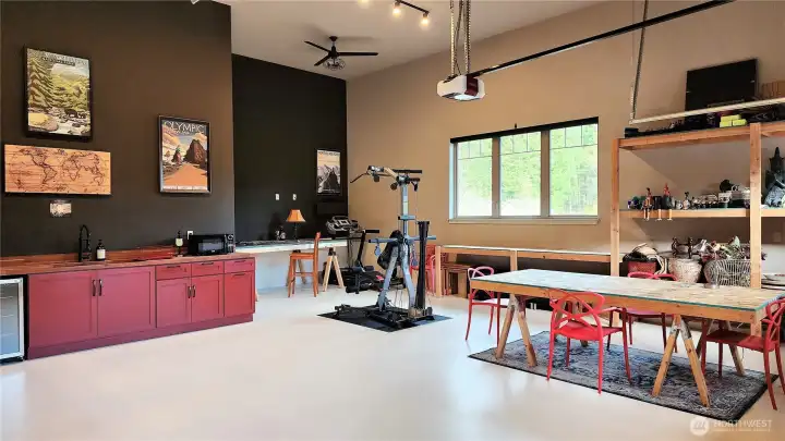 This finished, insulated 1,500-sq-ft (approx.) garage features soaring 20-foot ceilings and insulated XL glass-lite doors. Complete with a kitchenette and toilet, this massive conditioned space offers limitless potential to expand later.
