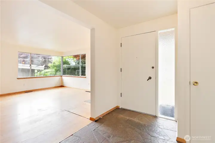 The entry features a slate floor, and directly accesses the living room The entry features a slate floor, and directly accesses the living room