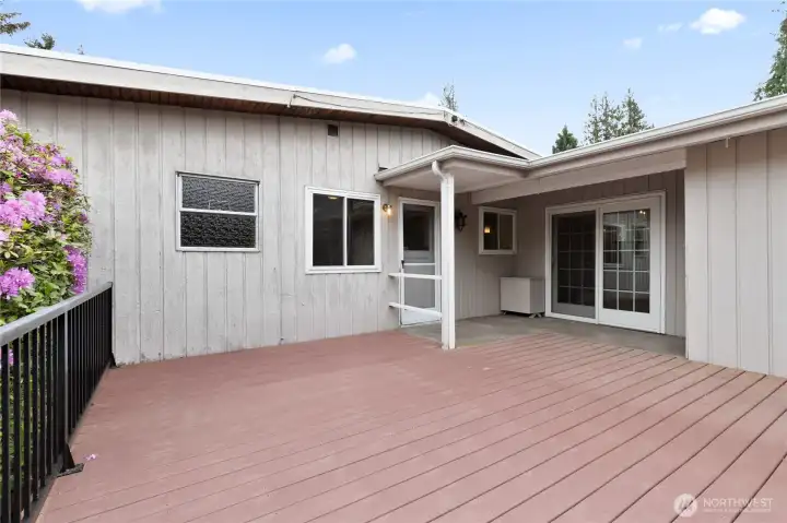 The deck is a custom Trex deck-with very low maintenance-and covered areas over the doorways. There are two doors providing direct deck access. The deck is a custom Trex deck-with very low maintenance-and covered areas over the doorways. There are two doors providing direct deck access.