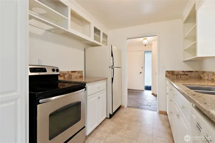 The kitchen has easily maintained vinyl flooring, and granite counters with a stainless-steel undermount dual sink. There is ample storage and cabinet space throughout. The kitchen has easily maintained vinyl flooring, and granite counters with a stainless-steel undermount dual sink. There is ample storage and cabinet space throughout.