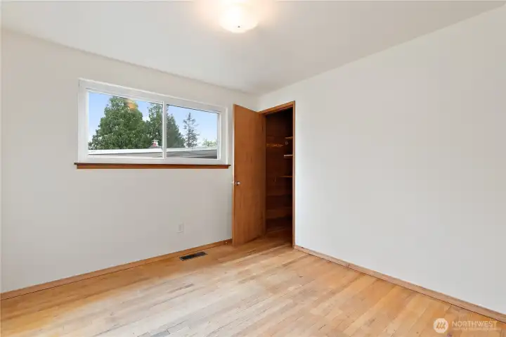 One of the hardwood-floored bedrooms. One of the hardwood-floored bedrooms.