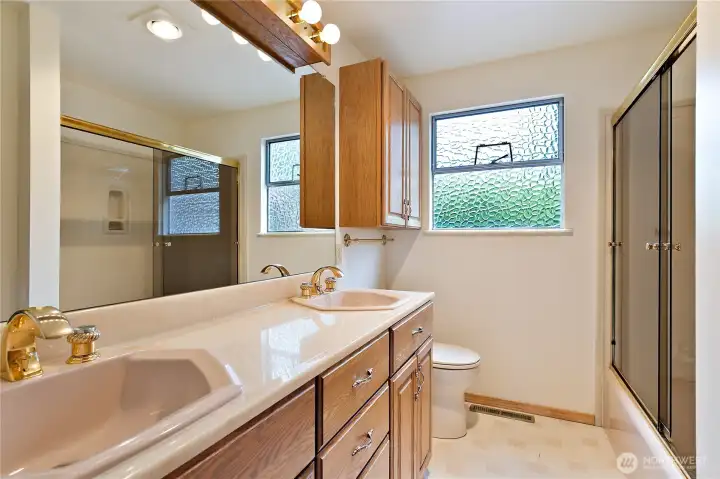 The primary bath suite, with a nice Corian counter with 2 sinks. The primary bath suite, with a nice Corian counter with 2 sinks.