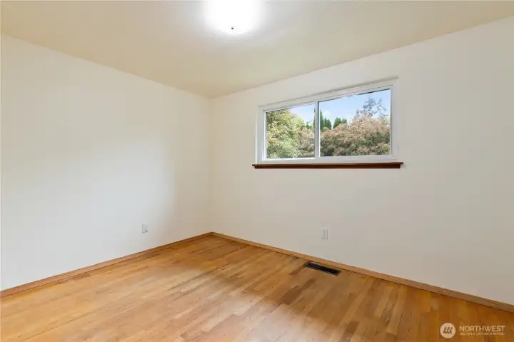 A hardwood floored upstairs bedroom A hardwood floored upstairs bedroom