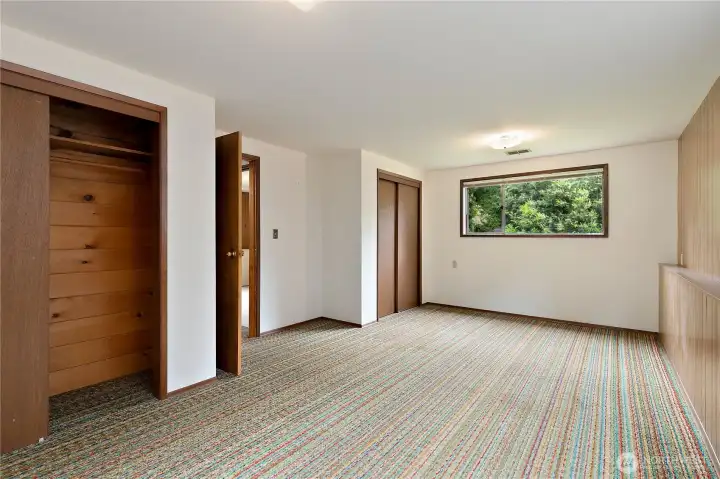The basement bedroom; notice the wall-to-wall carpeting, and the ceder-lined closet. The basement bedroom; notice the wall-to-wall carpeting, and the ceder-lined closet.