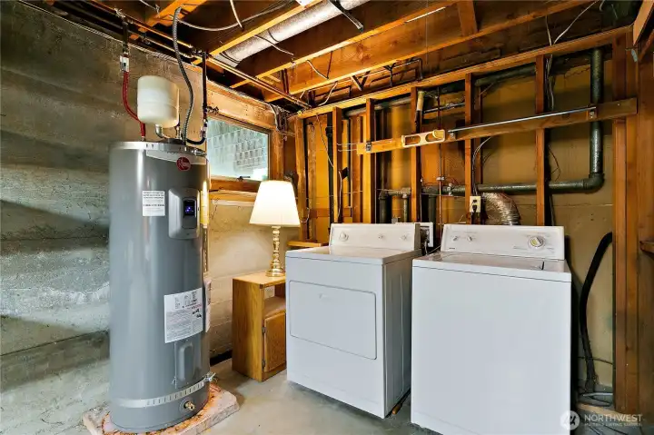 The washer and dryer in the laundry area of the basement. There is a new Rheem gas 50 gallon hot water heater. The washer and dryer in the laundry area of the basement. There is a new Rheem gas 50 gallon hot water heater.