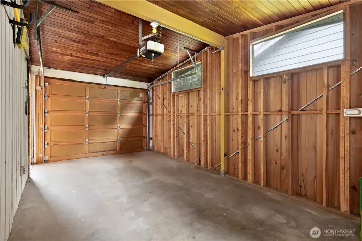 There is a one car garage with a power door, and a beautiful wood soffit ceiling. There is a one car garage with a power door, and a beautiful wood soffit ceiling.