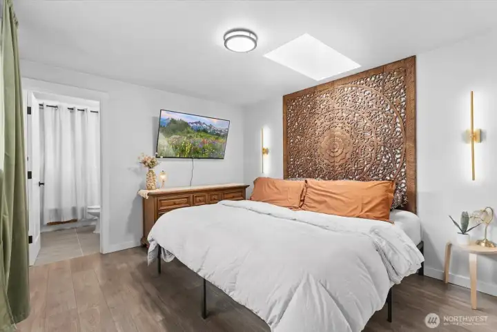 Primary Bedroom – Spacious primary retreat with air conditioning for year-round comfort.
