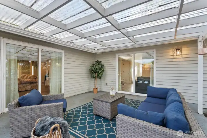 Patio/Outdoor Living – Great outdoor space for relaxing and hosting gatherings, accessible from both living room sliding doors.