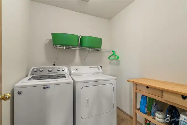 Laundry room is to the left at the top of the stairs.