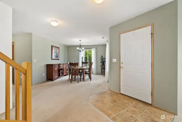 Entryway with large formal dining to the right of the door as you enter.