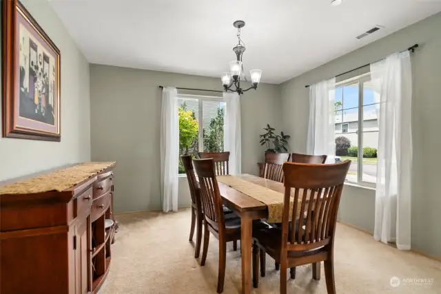 Formal dining area with room for a large table, hutch, or buffet!  Large picture windows let in lots of natural lighting.