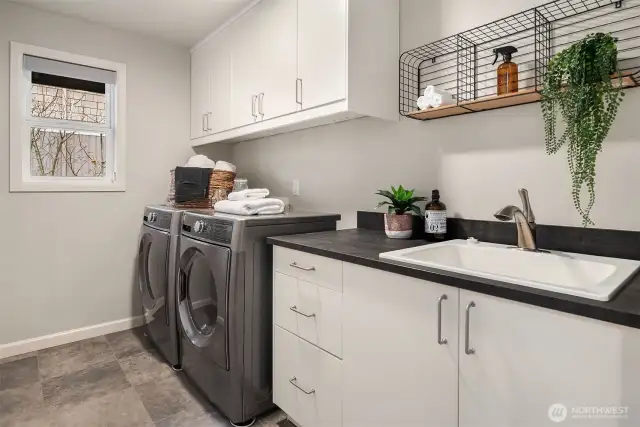 Upstairs laundry room is spacious and located between all of the bedrooms.