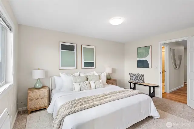 Conveniently located next to the bathroom, this large bedroom has lots of space.