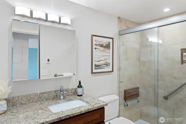 Updated Bathroom: Granite vanity, Toto toilet, large walk-in shower with tile surround,  hand-held shower, shampoo niche and flip-down shower seat, grab bar, heated floors, Delta quiet exhaust fan with humidity censor