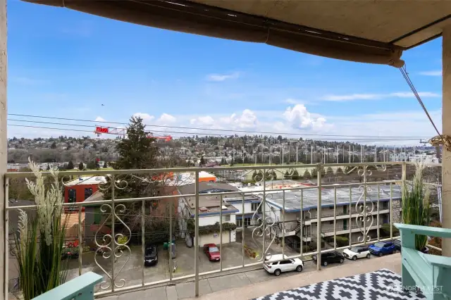Enjoy the view from the balcony- the perfect blend for convenience with nearby transit, shops, groceries, restaurants and parks.