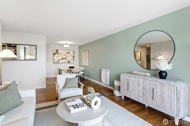 The living room opens seamlessly to the dining area off the kitchen with lots of light throughout.