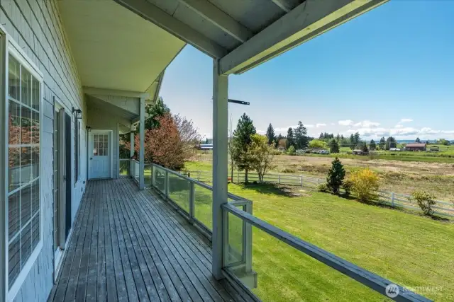 Enjoy the deck overlooking the beautiful back yard & land.