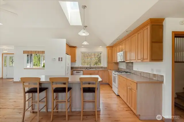Kitchen with island & bar stool seating.