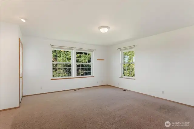 Primary bedroom suite with access to deck.