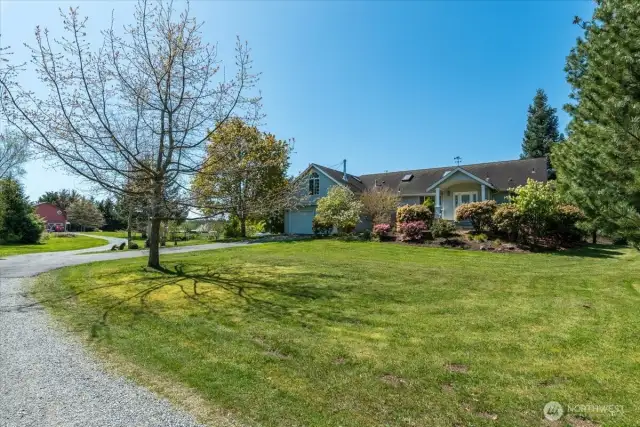 Front of home showcasing the mature landscaping & flower beds!