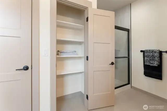 linen closet in primary bathroom