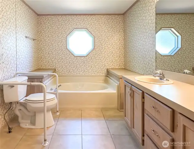 Primary bathroom with soaking tub. Not shown, a stand in shower and second sink