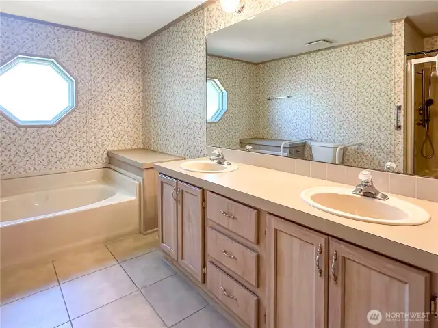 Primary bathroom. The shower is reflected on the mirror