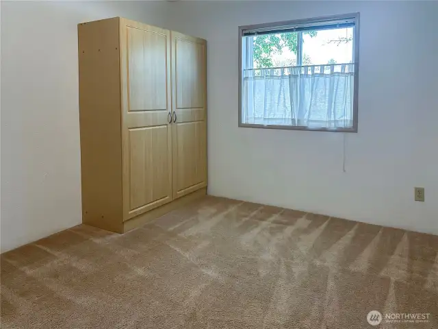 Second bedroom. The storage cabinet stays!