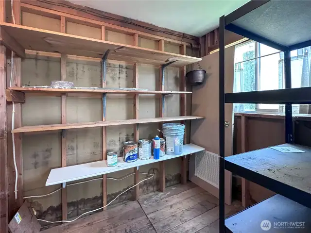 Shed with storage shelves.