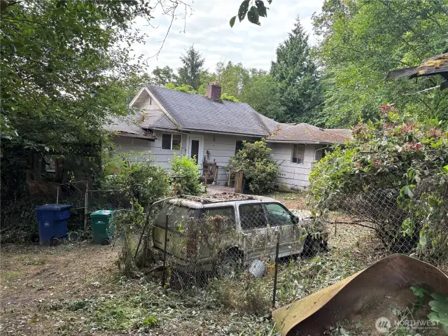view of house from near the garage. Yes, the cars come with it