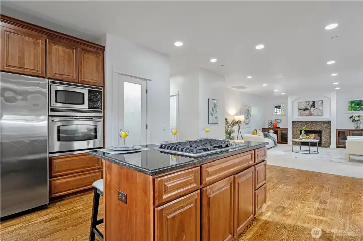 Stainless steel appliances, gas range, and ample cabinetry.