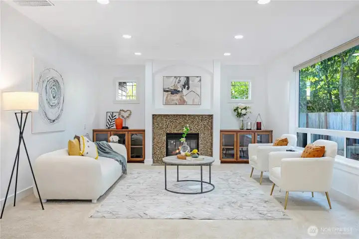 Cozy family room with fireplace and backyard views.