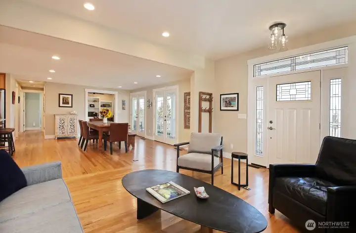 Living room is part of the great room, with entry, dining and kitchen spaces nicely defined; all have access to the lovely front porch.