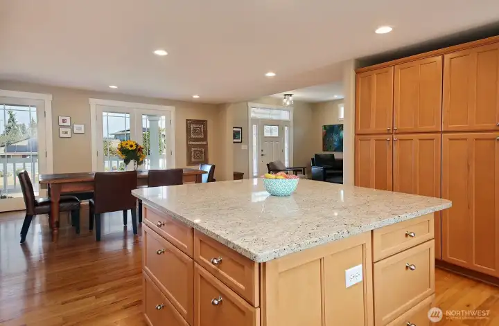 Gleaming countertops reflect the light coming in from all sides.