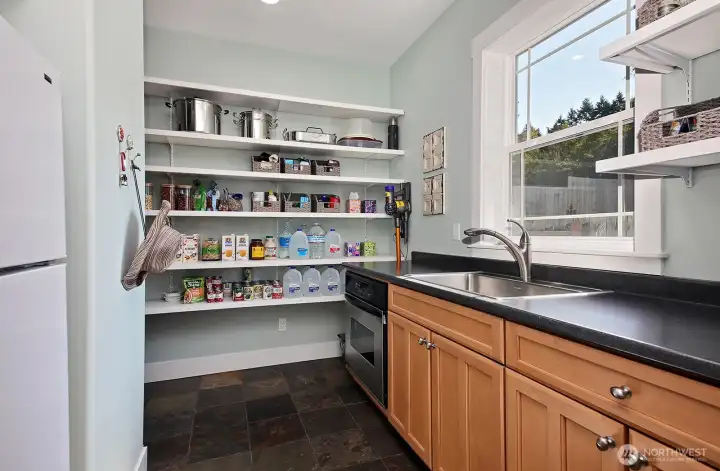 Second kitchen also with storage and utility room just behind on the left.
