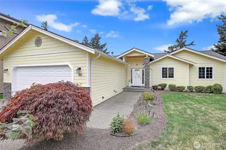 Situated on 65 feet of level, high-bluff waterfront…