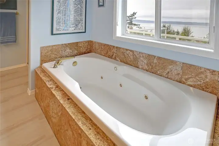 Featuring dual vanity, shower, and soaking tub!