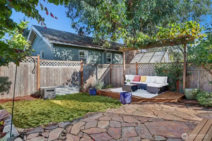 Step out to your own backyard oasis with a stone patio.