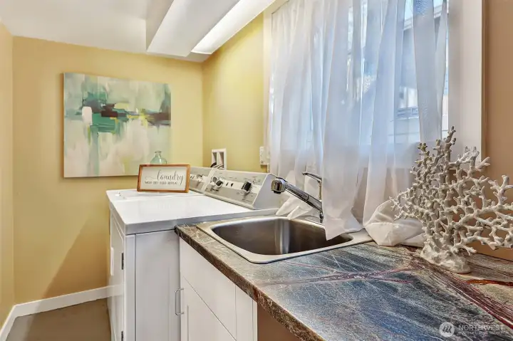Full laundry room also downstairs.