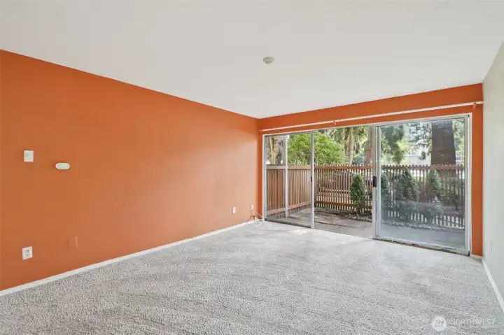 Living Area with Large Sliders Leading out to Patio