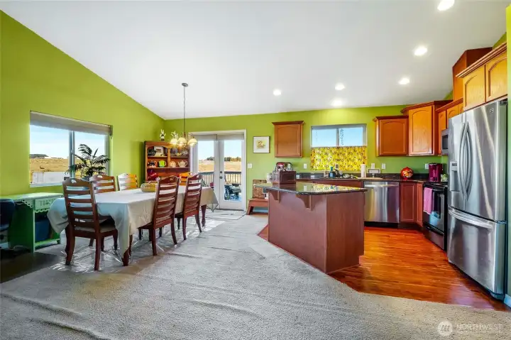 Warm vinyl plank kitchen flooring.
