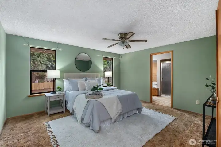 Large primary bedroom upstairs with view of backyard.   Three more bedrooms are located on the second level.
