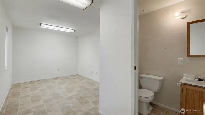Bonus room or den/office with attached half bath and access to the garage