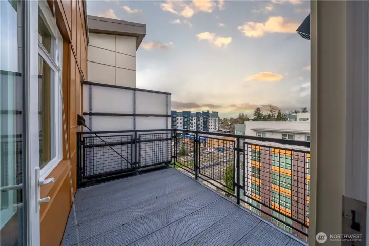 The inviting deck offers a perfect spot to unwind and enjoy sweeping territorial views, seamlessly paired with a vibrant urban lifestyle