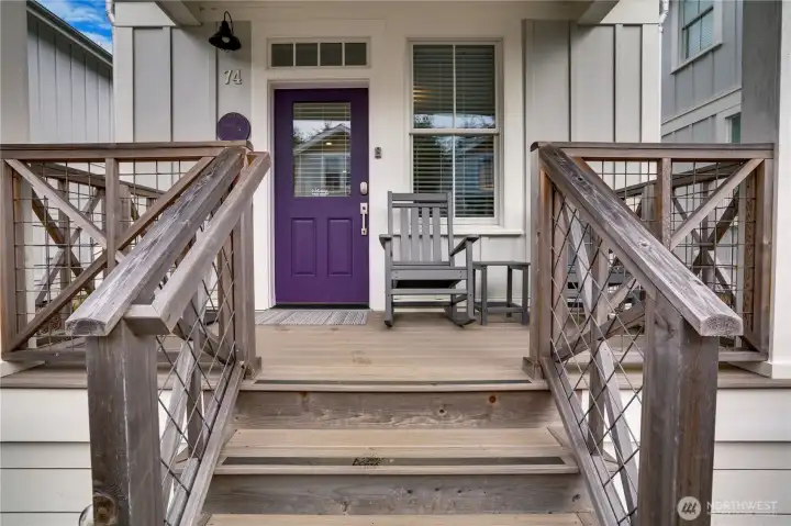 The inviting covered front porch is the perfect place to say hello to neighbors or relax with morning coffee. Come on in!