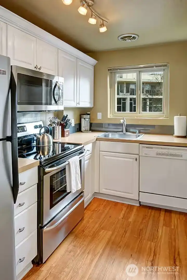 All kitchen supplies & appliances stay. Utility hook-up to left of kitchen.