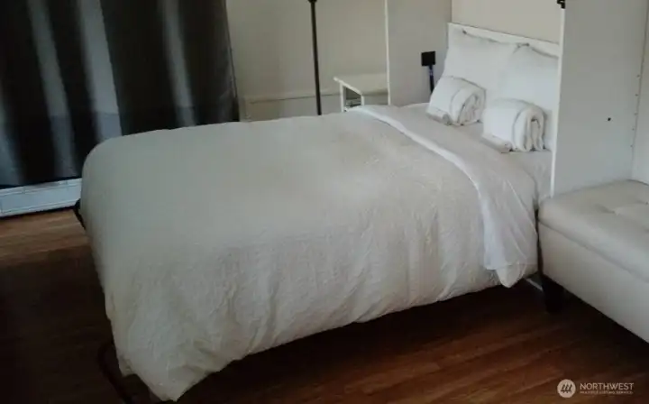 Murphy Bed in living room for more options (photo shows demonstration of bed down).