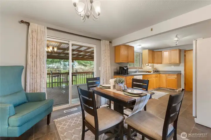Beautiful and spacious covered deck is just off the eating area.