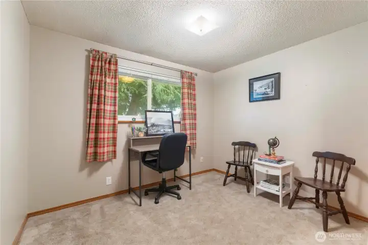 Bedroom #2 faces the park and is shaded by large tree in front yard. Great office or bedroom. Very nice storage system in the closet.